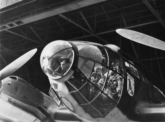 5 The cockpit of a captured Heinkel He 111 undergoing examination, 2 October 1940.