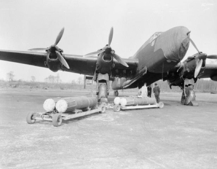 1 Sea mines wait to be loaded aboard a Halifax V Series IA   of No 77 - Copy